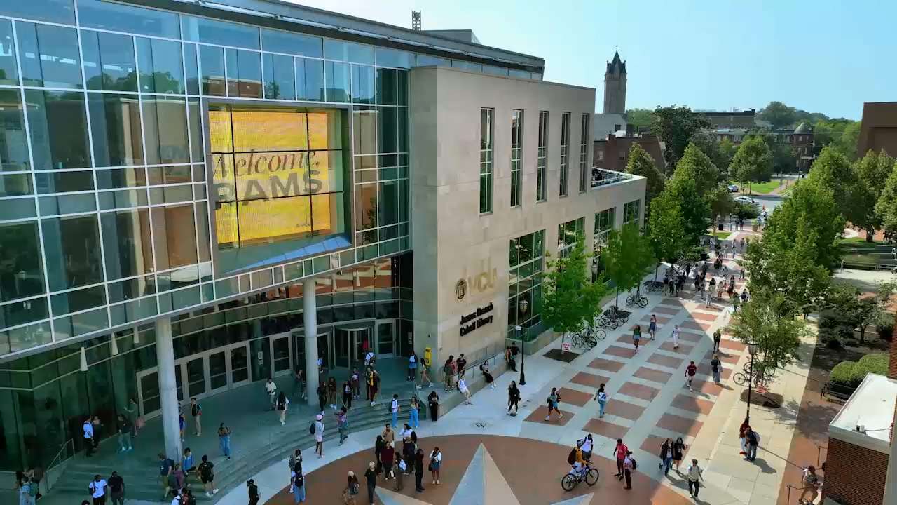 View of the library with students walking around the Compass